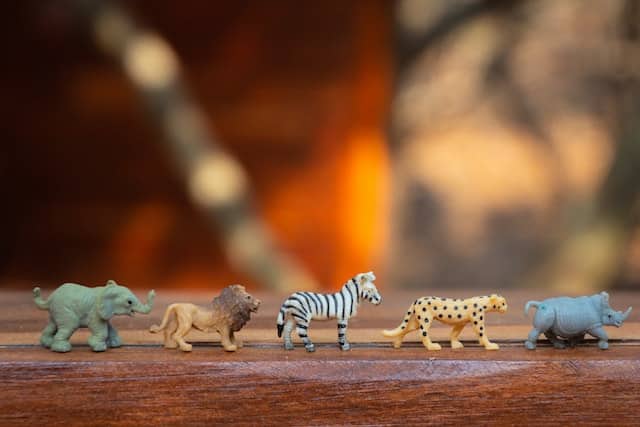 plastic-animal-toys-on-wooden-surface